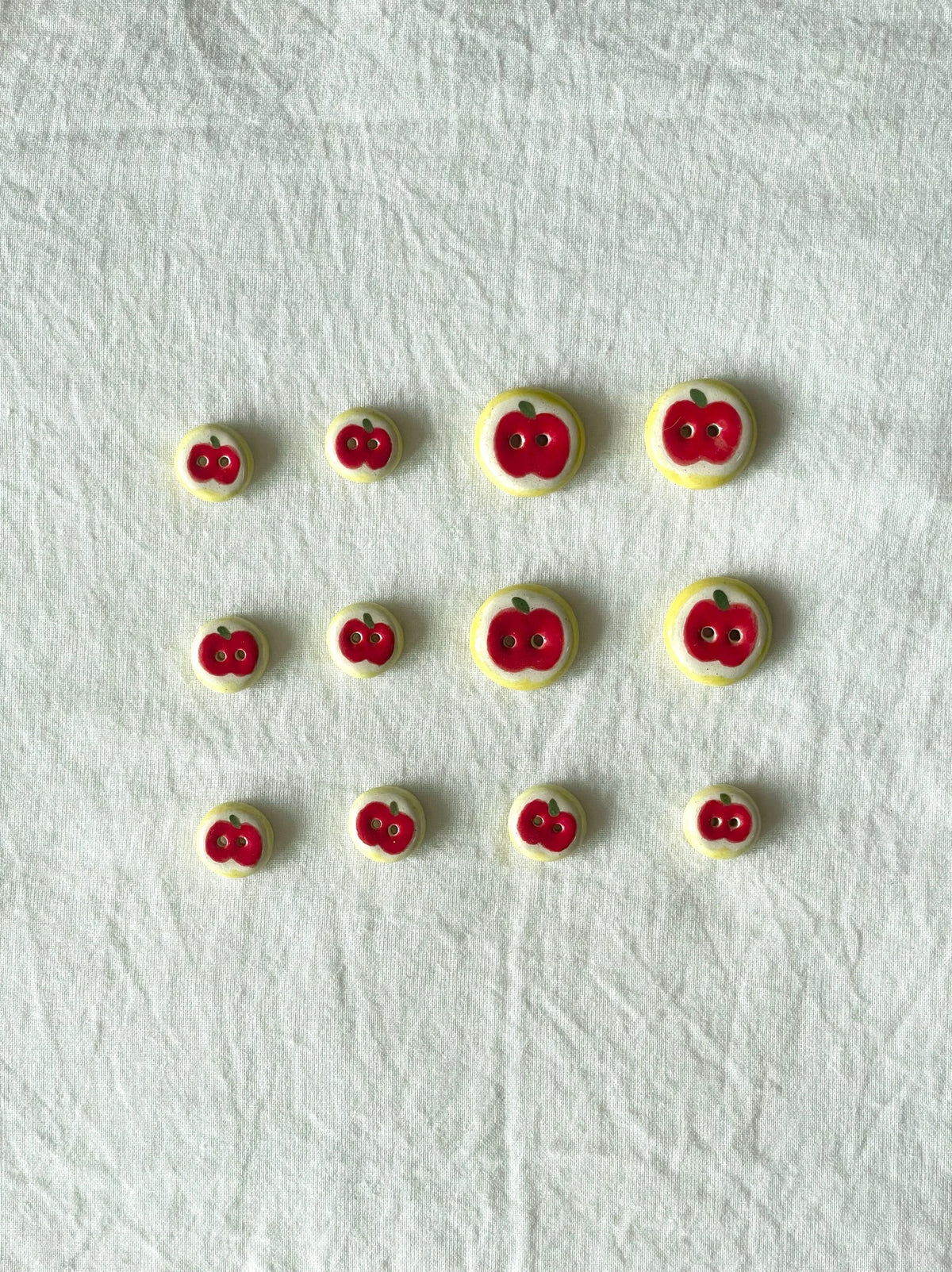 red apple buttons