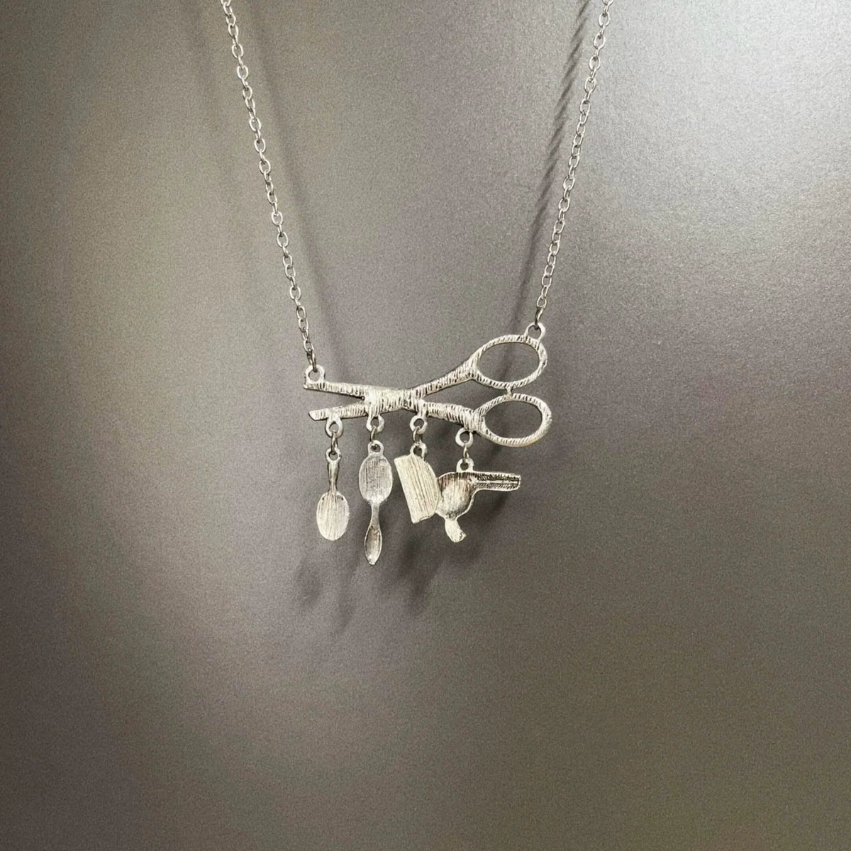 silver hair salon necklace